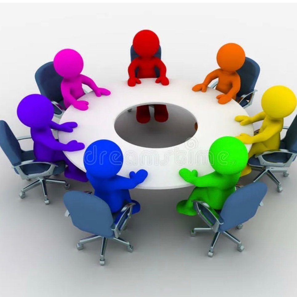 Люди сидят за круглым столом