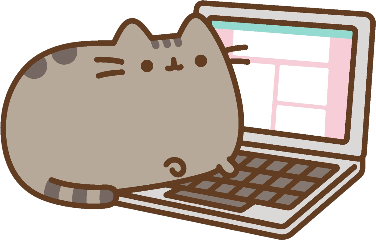 Кот в наушниках за компьютером