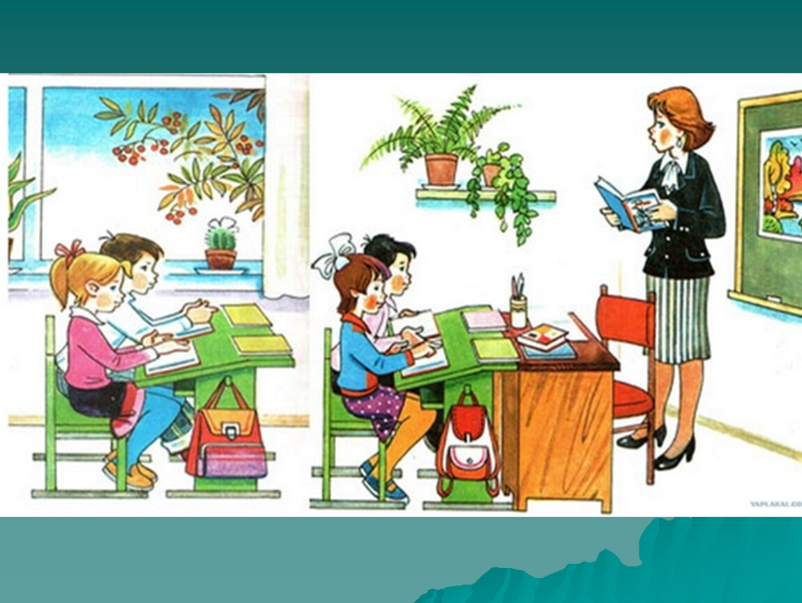 Учитель с учеником за партой