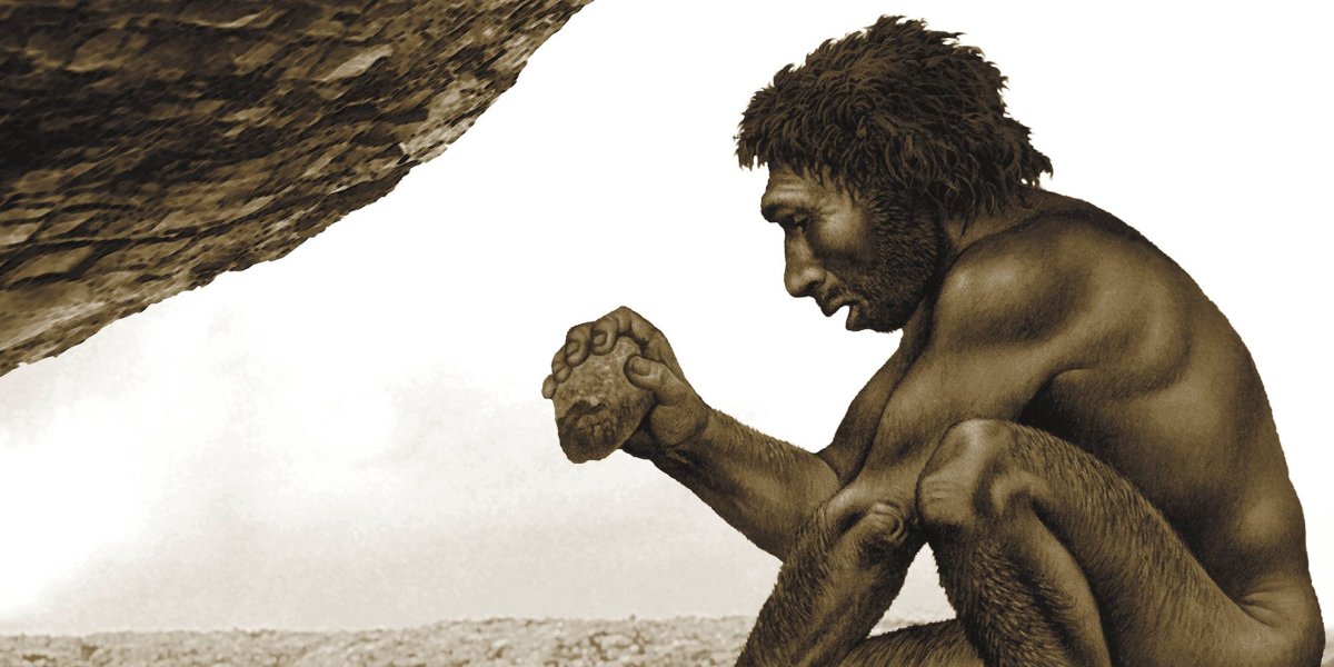 Доисторический человек с камнем