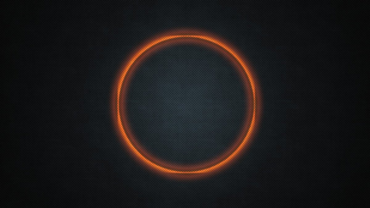 Оранжевый круг на черном фоне