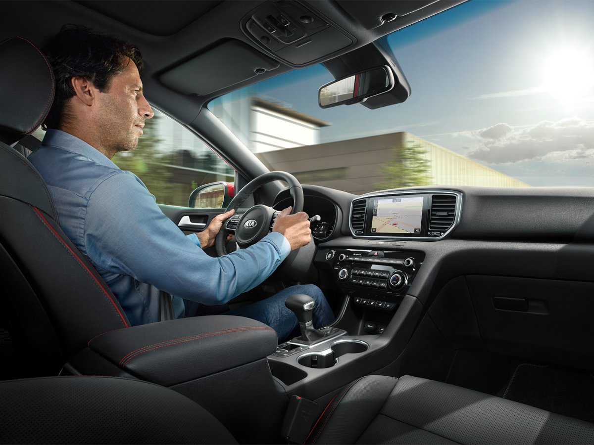 За рулем Kia Sportage