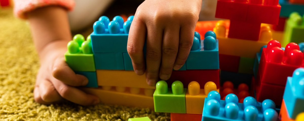 Girl playing LEGO