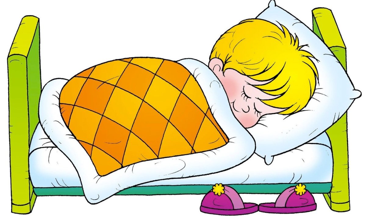 Мальчик спит в кровати