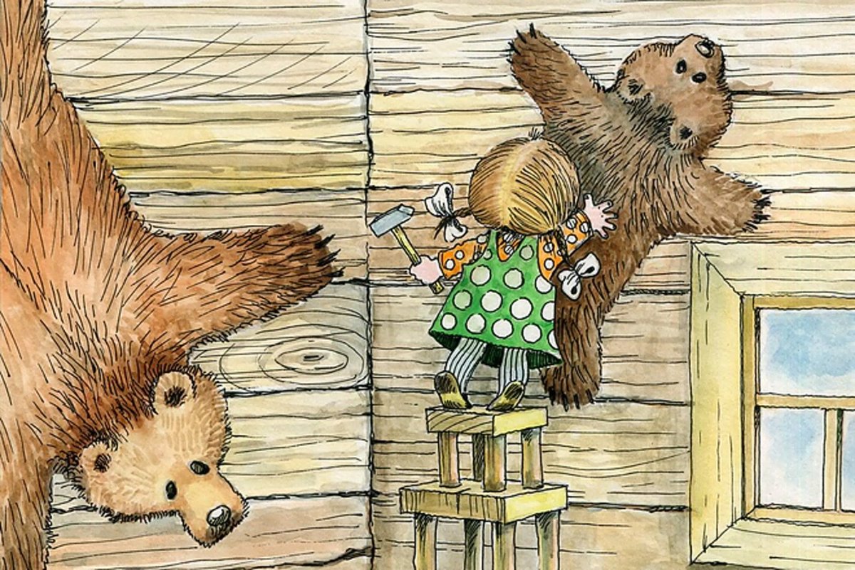 Маша прибивает шкуры медведей