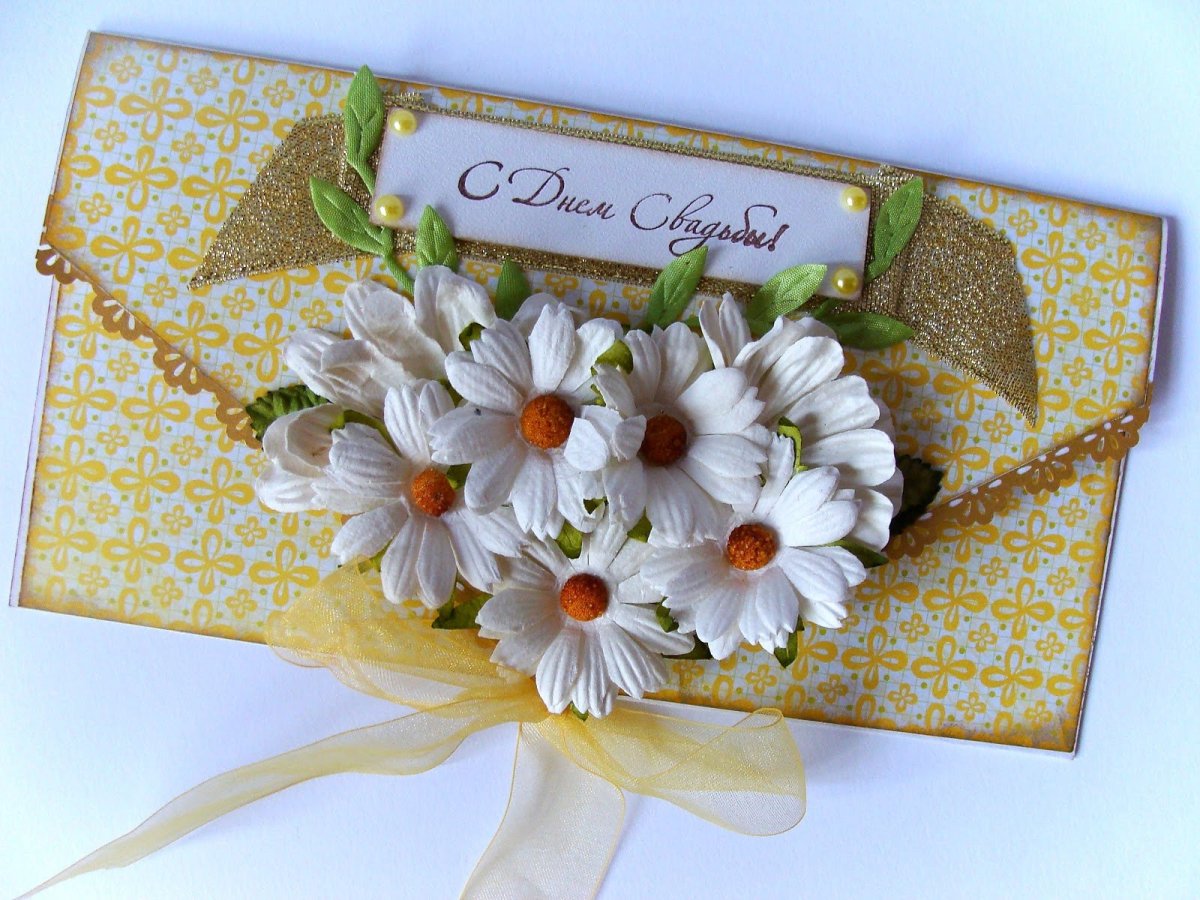 Свадебные кольца на ромашках