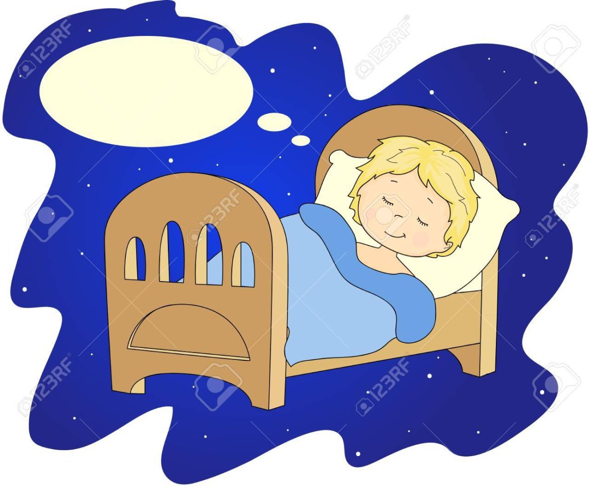 Мальчик спит в кроватке